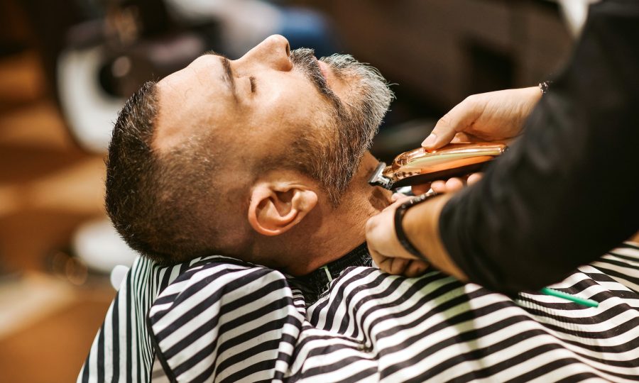 barber trims the beard